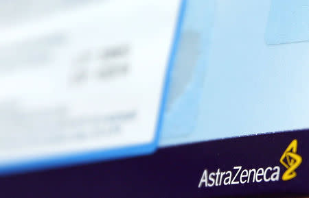 The logo of AstraZeneca is seen on medication packages in a pharmacy in London April 28, 2014. REUTERS/Luke MacGregor