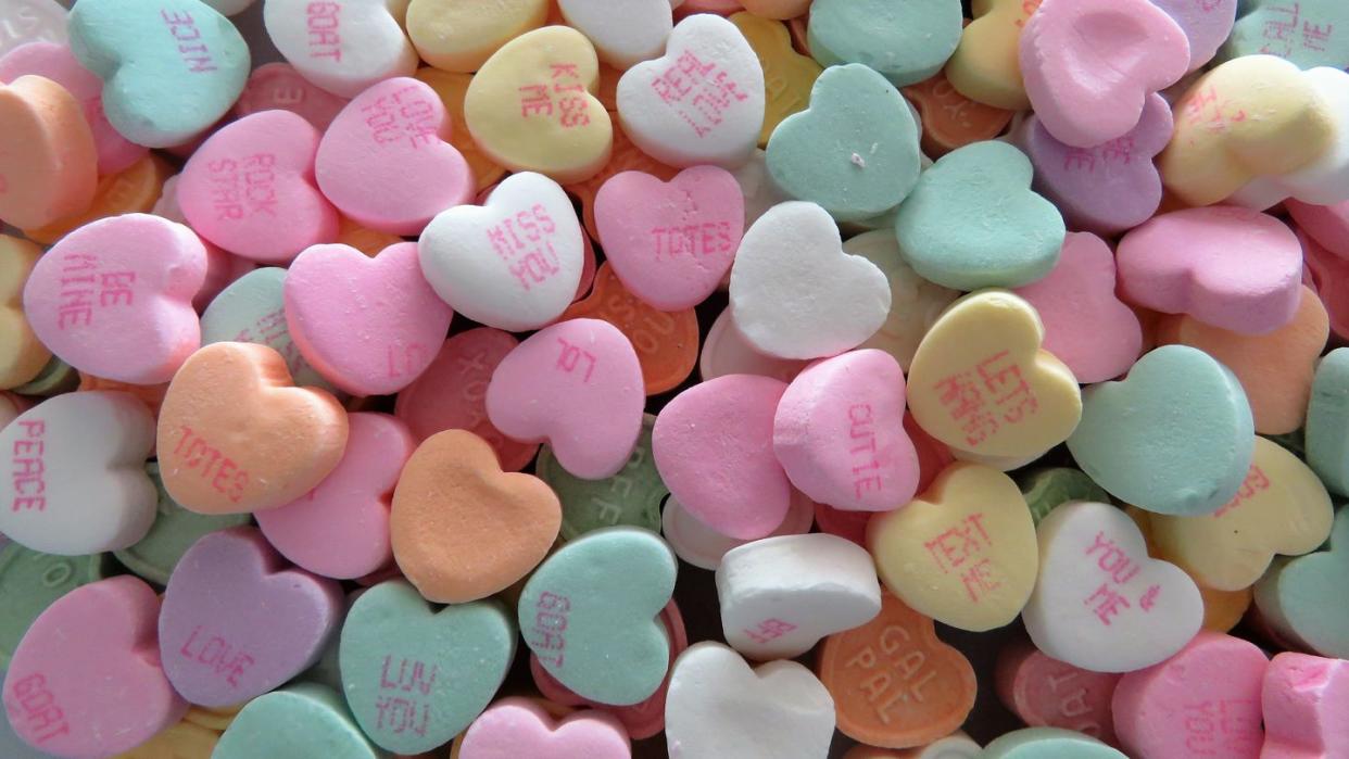 heart shaped conversation candies, background, copy space