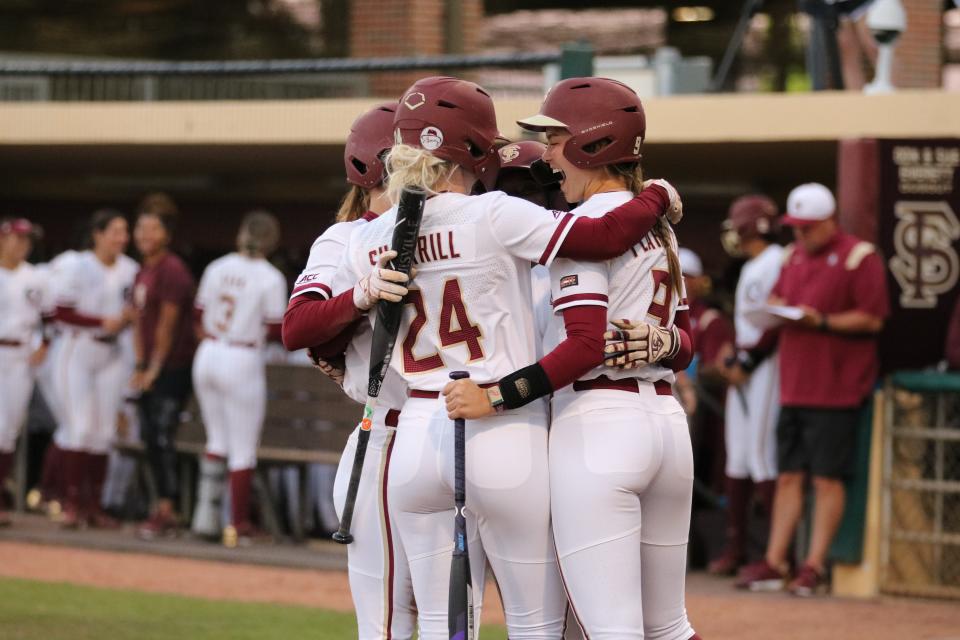 The FSU softball team celebrates Sydney Sherrill's home run in the Seminoles' 3-0 win over Pittsburgh on Friday, March 4, 2022.