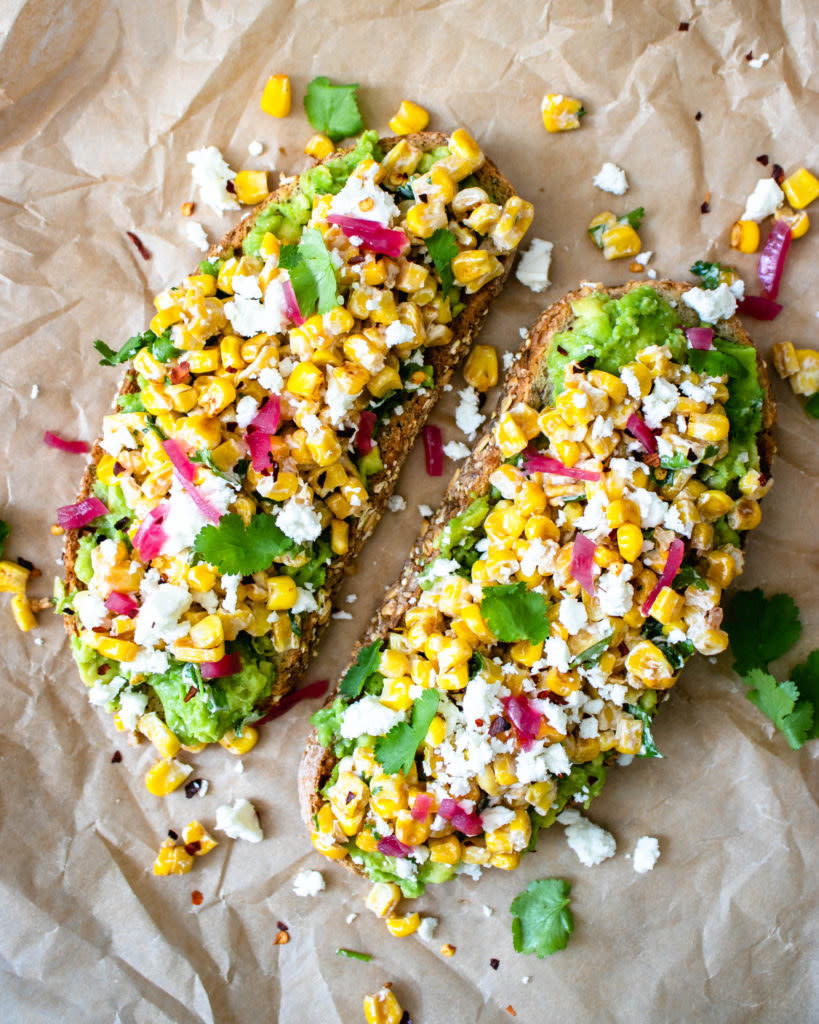 Avocado toast topped with Mexican street corn.