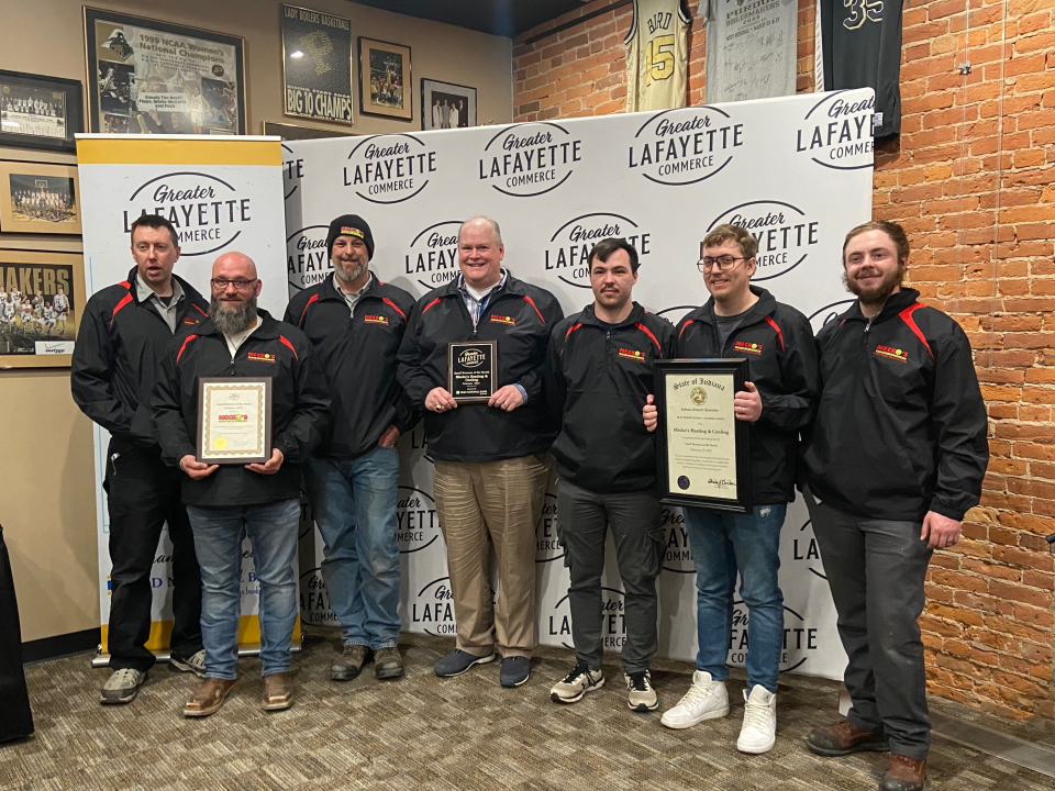 Employees of Mecko's Heating & Cooling celebrate the award for Small Business of the Month, given by the Greater Lafayette Commerce for February 2022.