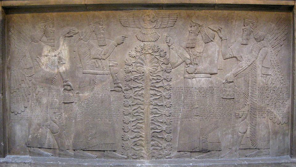 A relief from ancient Assyria with two winged mythological beings and the god Ashur before the tree of life. From the State Hermitage in St. Petersburg, Russia. <a href="https://www.gettyimages.com/detail/news-photo/relief-with-two-figures-of-ashurnasirpal-winged-news-photo/464450757?adppopup=true" rel="nofollow noopener" target="_blank" data-ylk="slk:Fine Art Images/Heritage Images/Getty Images;elm:context_link;itc:0;sec:content-canvas" class="link ">Fine Art Images/Heritage Images/Getty Images</a>