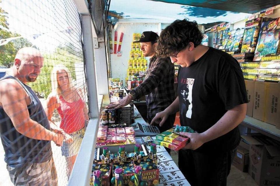 People buy fireworks at a fireworks stand in Templeton in 2012. So-called “safe and sane” fireworks are only allowed in some San Luis Obispo County locations.