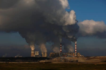 FILE PHOTO: Smoke and steam billows from Belchatow Power Station, Europe's largest coal-fired power plant operated by PGE Group, near Belchatow, Poland November 28, 2018. REUTERS/Kacper Pempel/File Photo