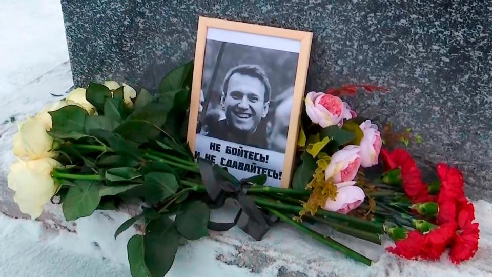 PHOTO: This grab taken from video shows flowers and a portrait of Russian opposition leader Alexei Navalny that Lyudmila Navalnaya, mother of Russian opposition leader, put to pay tribute to her son, in Salekhard, Russia, on Tuesday, Feb. 20, 2024. (AP)