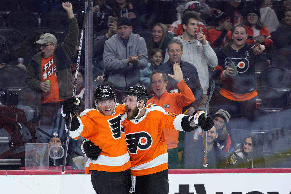 Philadelphia Flyers' Nicolas Deslauriers, right, and Brendan Lemieux celebrate after a goal by Deslauriers during the second period of an NHL hockey game against the Detroit Red Wings, Sunday, March 5, 2023, in Philadelphia. (AP Photo/Matt Slocum)