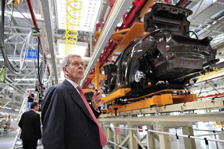 Philippe Varin, chief executive officer of French carmaker PSA Peugeot Citroen, visits the third factory of Dongfeng Peugeot Citroen Automobile company after its inauguration ceremony in Wuhan, July 2, 2013. REUTERS/China Daily