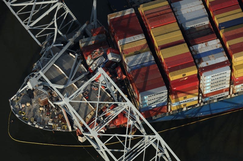 In an aerial view, crushed shipping containers are seen on the bow of the cargo ship Dali after it stuck and collapsed the Francis Scott Key Bridge, April 09, 2024 in Baltimore, Maryland. The Unified Command has started removing containers from the Dali while also working to clear the channel to restore the flow of commerce to the Port of Baltimore. The bridge collapsed after being struck by the 984-foot cargo ship Dali at 1:30 AM on March 26. - Photo: Kevin Dietsch/Getty Images (Getty Images)