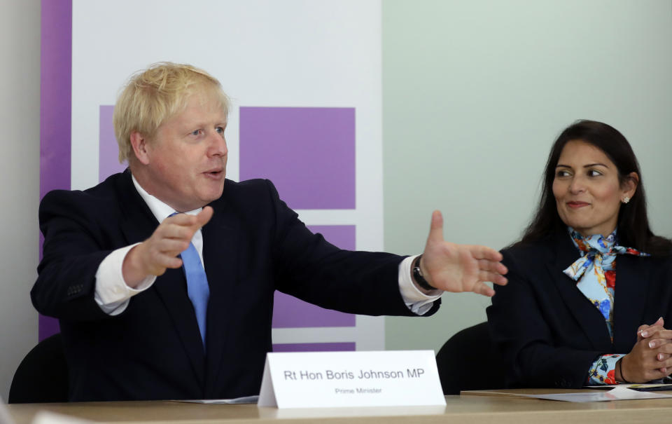 Prime Minister Boris Johnson with Home Secretary Priti Patel attending the first meeting of the National Policing Board at the Home Office in London.