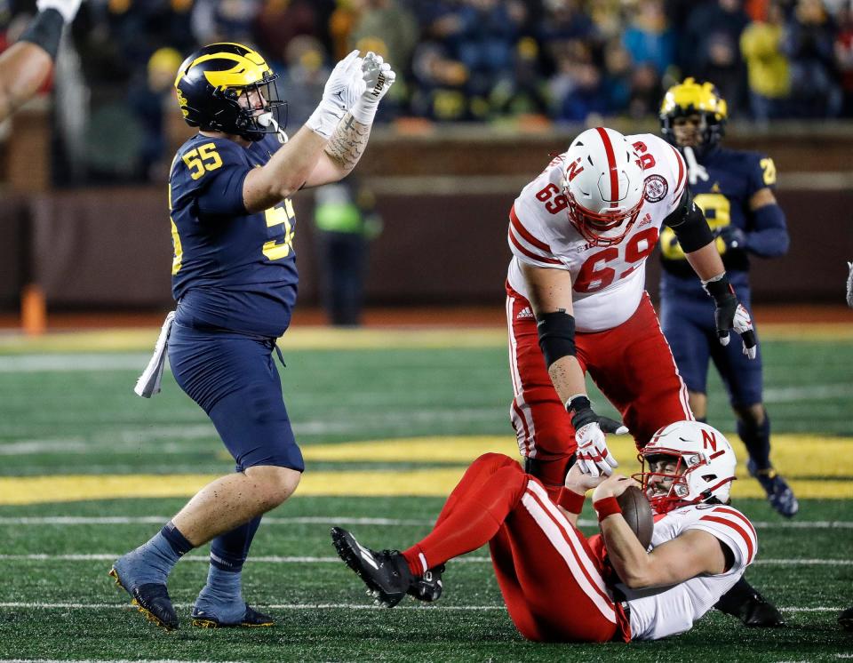 Michigan defensive lineman Mason Graham (55) celebrates a tackle against Nebraska quarterback Logan Smothers (8) during the second half at Michigan Stadium in Ann Arbor on Saturday, Nov. 12, 2022.