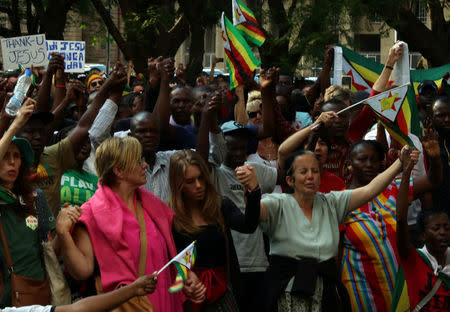 Residents attend a prayer meeting called to celebrate after Zimbabwean President Robert Mugabe was dismissed as party leader of the ruling ZANU-PF's central committee in Harare, Zimbabwe, November 19, 2017. REUTERS/Philimon Bulawayo