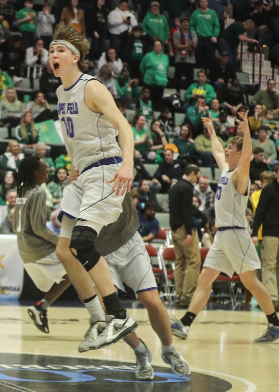 Leam Powell and Chapel Field celebrate after defeating North Warren 47-46 to win a NYSPHSAA Class D semifinal basketball game at the Cool Insuring Arena in Glens Falls March 18, 2023. Powell hit the winning shot with twelve seconds left in the game. 