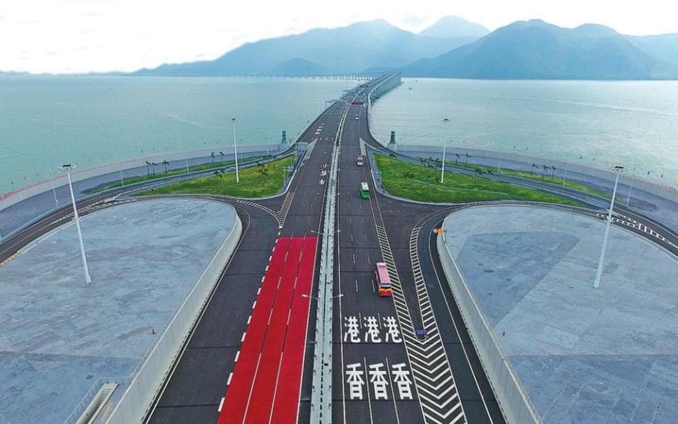 Vehicles cross the Hong Kong-Zhuhai-Macao Bridge on 24 October 2018, a day after its opening ceremony - XINHUA