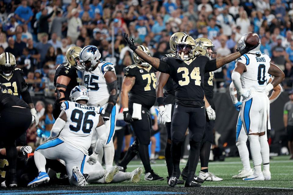 CHARLOTTE, NORTH CAROLINA - SEPTEMBER 18: Tony Jones Jr. #34 of the New Orleans Saints a touchdown against the Carolina Panthers during the third quarter in the game at Bank of America Stadium on September 18, 2023 in Charlotte, North Carolina. (Photo by Jared C. Tilton/Getty Images)