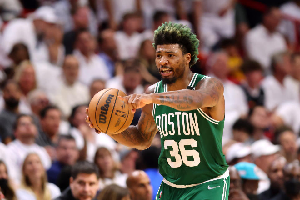 MIAMI, FLORIDA - MAY 19: Marcus Smart #36 of the Boston Celtics brings the ball up court during the fourth quarter against the Miami Heat in Game Two of the 2022 NBA Playoffs Eastern Conference Finals at FTX Arena on May 19, 2022 in Miami, Florida. NOTE TO USER: User expressly acknowledges and agrees that, by downloading and or using this photograph, User is consenting to the terms and conditions of the Getty Images License Agreement. (Photo by Michael Reaves/Getty Images)