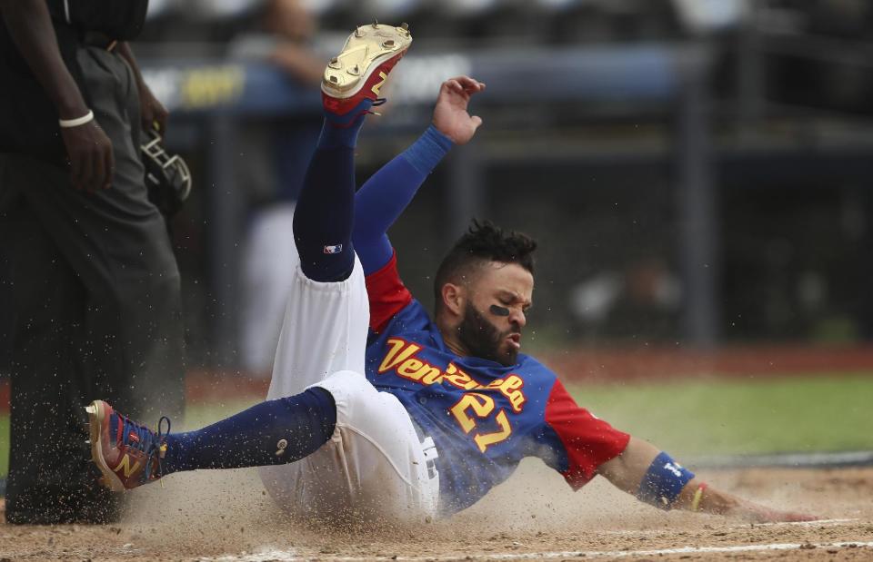 Venezuela's Jose Altuve scores a run in the fifth inning of a World Baseball Classic game against Italy, in Guadalajara, Mexico, Saturday, March 11, 2017. (AP Photo/Luis Gutierrez)