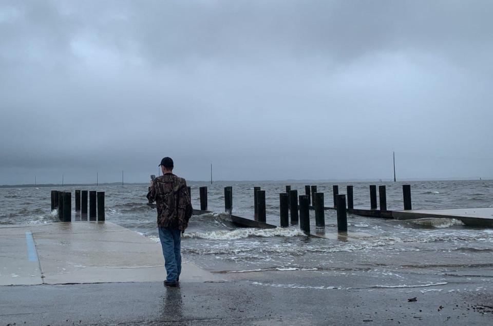 The Port St. John boat ramp is battered by waves as the river levels rise Wednesday afternoon.