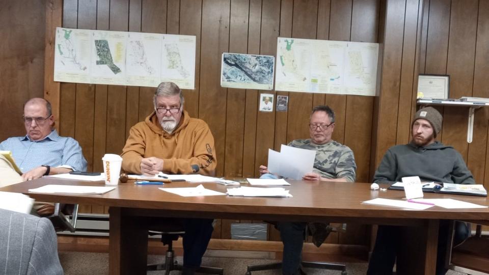 From left are Texas Township Solicitor John Martin and supervisors Daniel Weidner (chairperson), John Rothrock and Shane Farrell at the March 19, 2024, conditional use hearing for the workforce housing project proposed at the at the White Mills Hotel.
