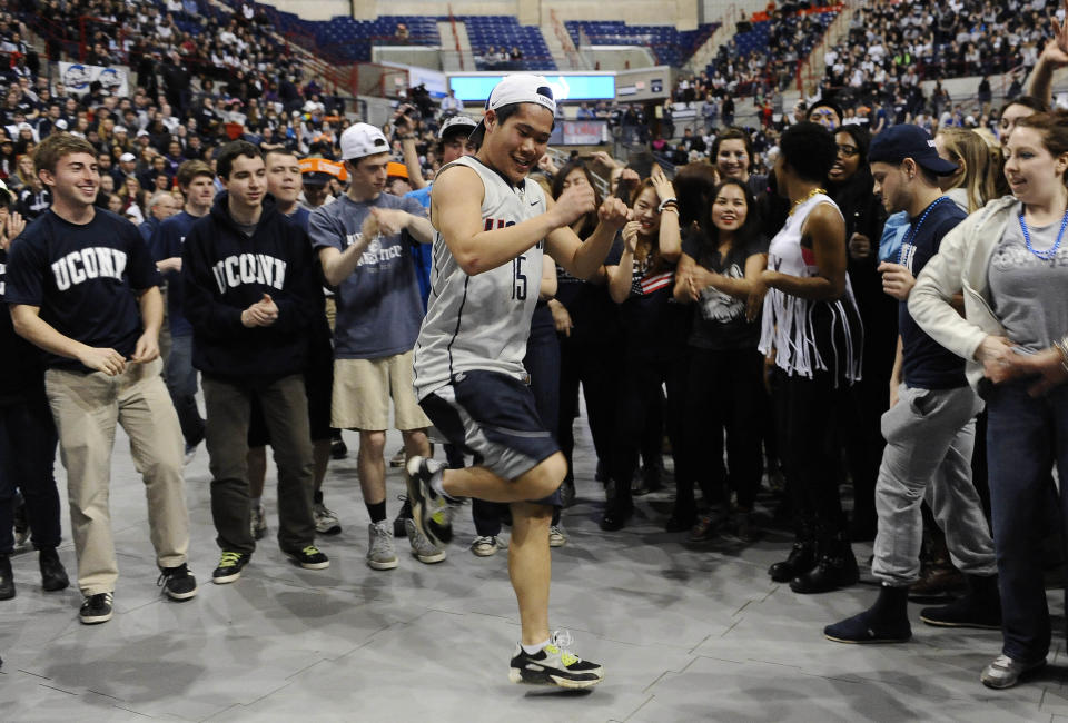 Hardy Chen of Farmington, Conn. dances at halftime during the broadcast of the UConn and Notre Dame women's basketball game for the NCAA title, Tuesday, April 8, 2014, in Storrs, Conn. (AP Photo/Jessica Hill)