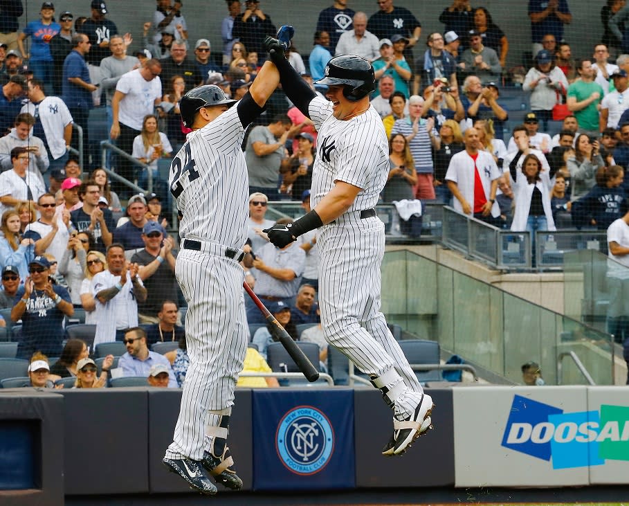 Luke Voit (right) celebrates with Gary Sanchez after hitting a home run in the Yankees postseason-clinching win against the Orioles at Yankee Stadium. (Getty Images)