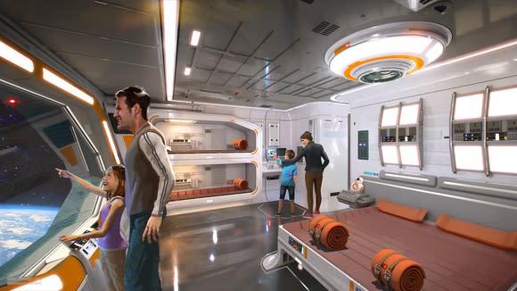 A Star Wars as a spaceship hotel with a man and a girl looking out a big window and a woman and a boy walking around a big bed in the middle with orange blankets and pillows and a bunk bed on the side in the same colors.