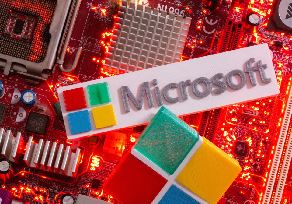 3D-printed Microsoft logos are seen on a computer motherboard in this picture illustration taken July 22, 2021. REUTERS/Dado Ruvic/Illustration - RC2BPO9KW4R4