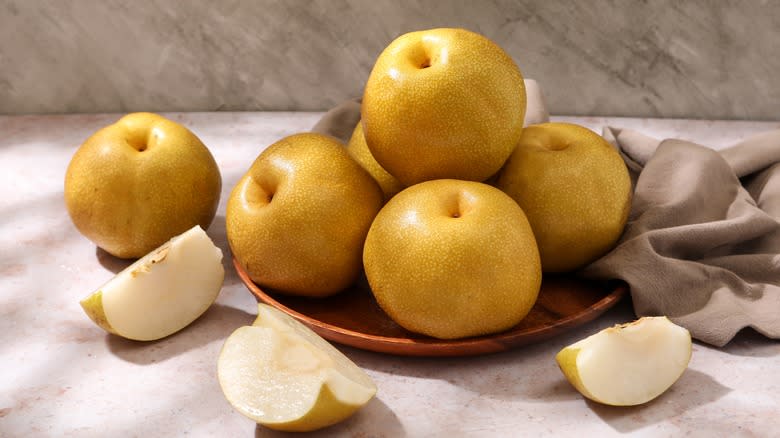 round, yellow, asian pears on a plate