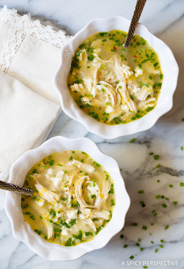 two bowls of the soup with shredded chicken