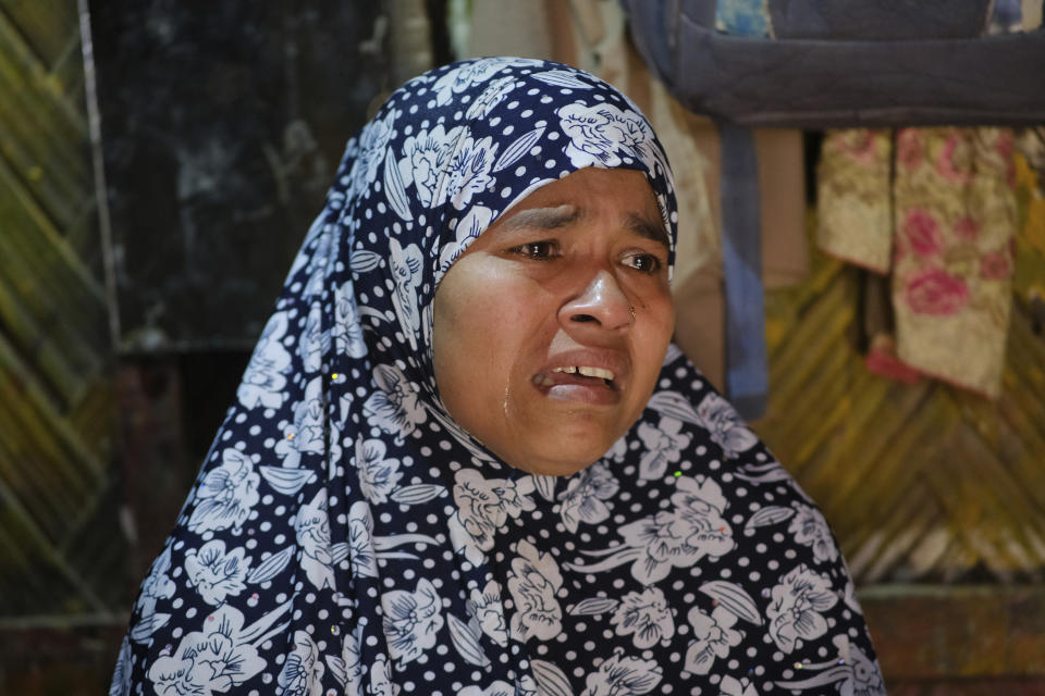 Rohingya refugee Dildar Begum speaks about two of her sons, 18-year-old Noor Hassan, and 16-year-old Noor Hashim, who fled Bangladesh’s refugee camps in December, during an interview in the Nayapara refugee camp in Teknaf, part of the Cox's Bazar district of Bangladesh, on March 10, 2023. The teens were on a boat of around 180 Rohingya refugees that vanished a week into its journey to Indonesia. (AP Photo/Mahmud Hossain Opu)