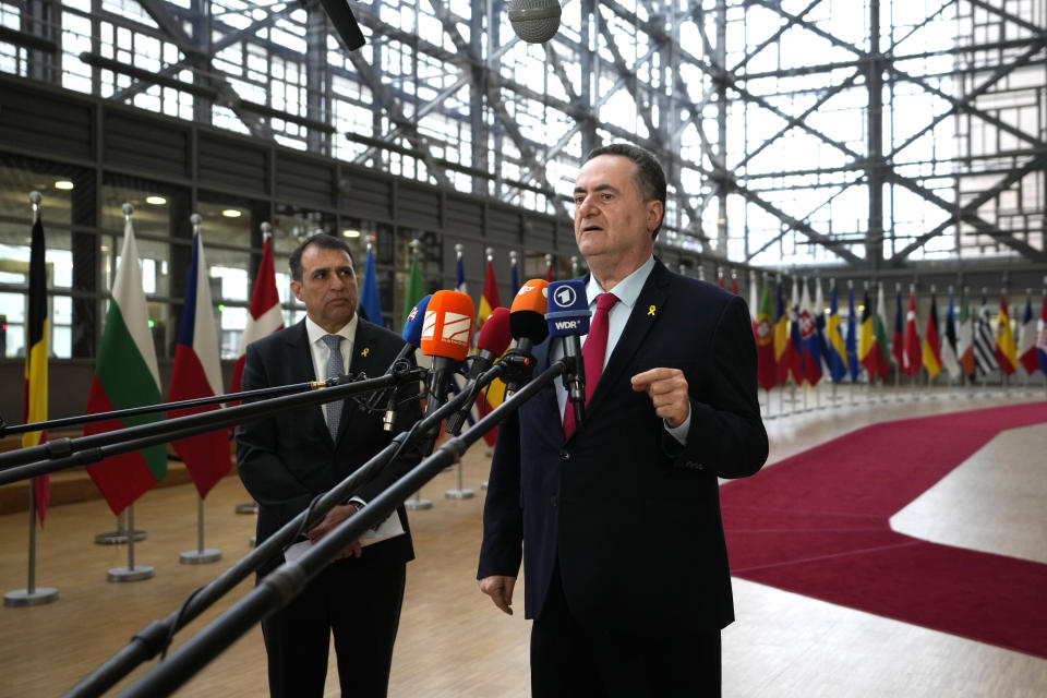 Israel's Foreign Minister Israel Katz, right, speaks with the media as he arrives for a meeting of EU foreign ministers at the European Council building in Brussels, Monday, Jan. 22, 2024. European Union Foreign Affairs Ministers meet in Brussels on Monday to discuss the situation in the Middle East and in Ukraine. (AP Photo/Virginia Mayo)