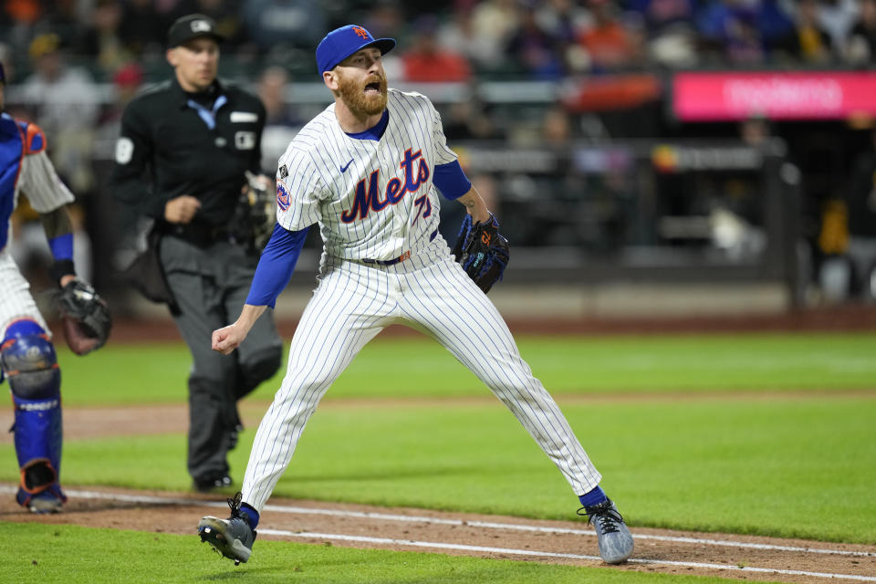 New York Mets pitcher Reed Garrett reacts after committing a throwing error during the seventh inning of a baseball game at Citi Field, Tuesday, April 16, 2024, in New York. (AP Photo/Seth Wenig)