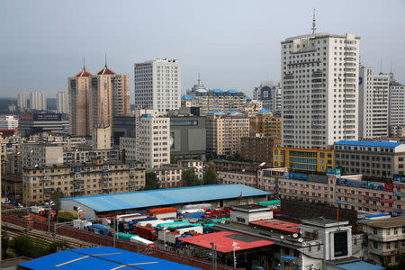 Trucks are parked in the yard of the customs office in China's Dandong, Liaoning province, as their drivers wait to cross Friendship Bridge to North Korea's Sinuiju September 12, 2016. REUTERS/Thomas Peter