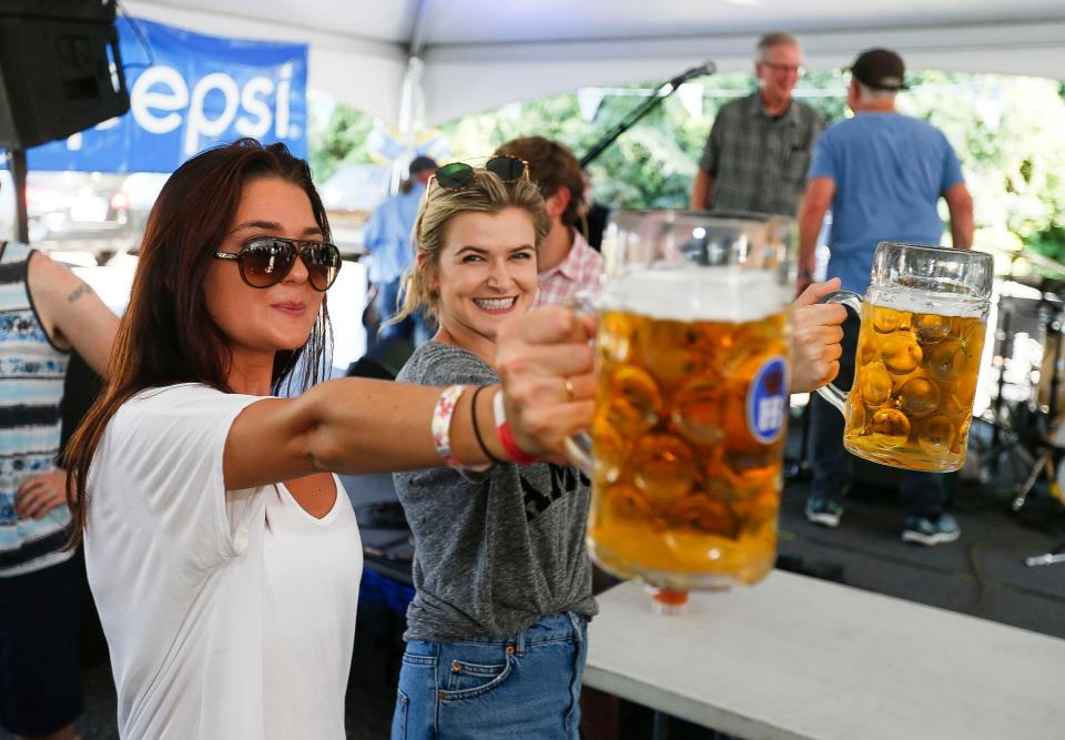 Attendees compete in a stein holding competition at Tuscaloosa Oktoberfest near 301 Greensboro Ave in Tuscaloosa, Ala. on Saturday, Oct. 6, 2018.