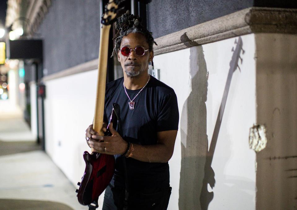 Detroit bass player Grover Tigue says he's the "squeaky wheel in his circle of people" who enourages good recordkeeping for gig workers. Tigue before performing at Craft Cannabis Club in Detroit on Sept. 15, 2021.