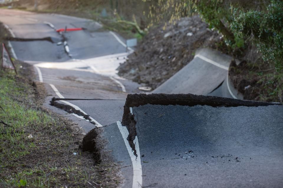 The road looks as if it's been 'torn up by an earthquake' according to locals (SWNS)