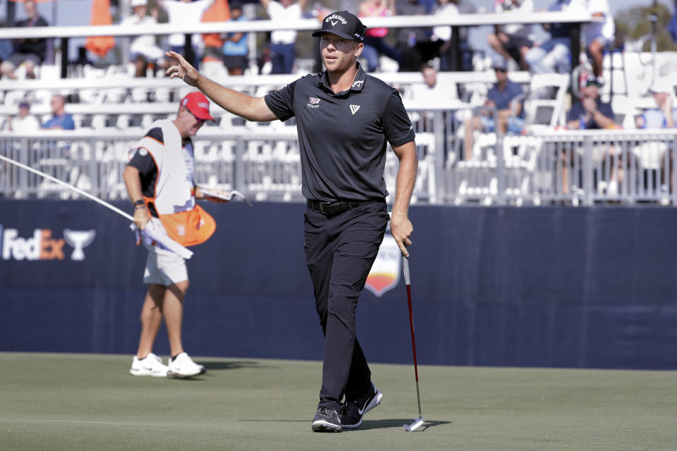 Talor Gooch waves to the gallery after his birdie on the 15th green during the first round of the Houston Open golf tournament Thursday, Nov. 11, 2021, in Houston. (AP Photo/Michael Wyke)