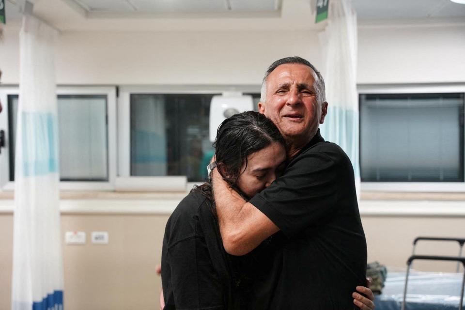 Noa Argamani, a rescued hostage, hugs her father, Yakov Argamani, after the army said Israeli forces rescued four hostages alive from the central Gaza Strip, in Ramat Gan, Israel, in this broadcast image obtained by Reuters on June 8, 2024.