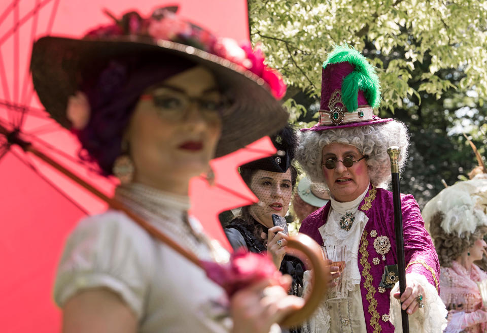 <p>Participants of the so called “Victorian Picnic” relax in fancy costumes during the Wave Gothic Festival (WGT) in Leipzig, Germany, Friday, June 2, 2017. (AP Photo/Jens Meyer) </p>