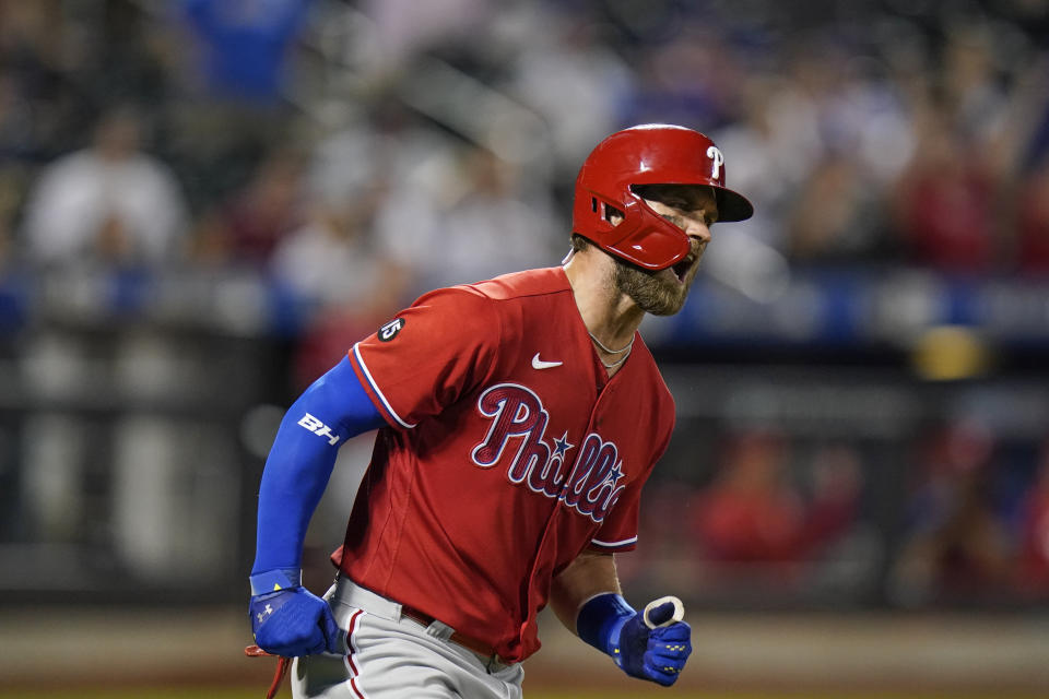 Philadelphia Phillies' Bryce Harper celebrates as he runs the bases after hitting a home run during the sixth inning of the second baseball game of a doubleheader against the New York Mets Friday, June 25, 2021, in New York. (AP Photo/Frank Franklin II)