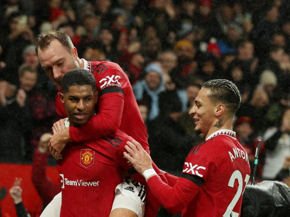 Marcus Rashford celebrates scoring with Christian Eriksen and Antony (REUTERS)