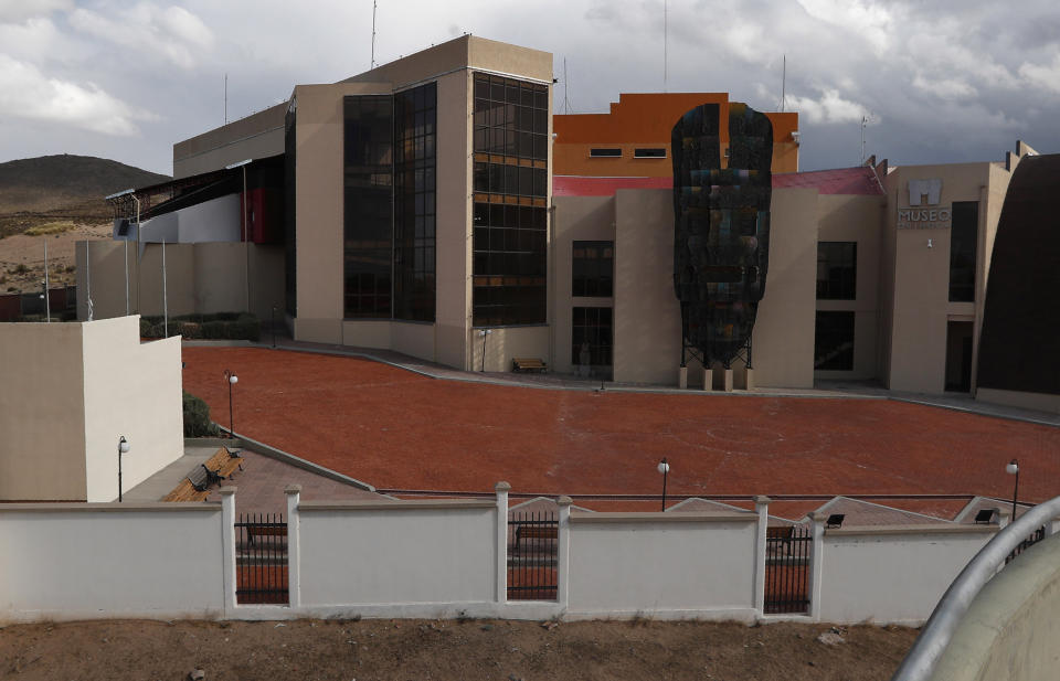 This Sept. 13, 2019 photo shows the front of the Democratic and Cultural Revolution Museum, in Orinoca, Bolivia. From the air the building stands like a concrete fortress amid the humble adobe and brick homes in the remote town of Orinoca high up in the desert of the Bolivian altiplano. (AP Photo/Juan Karita)