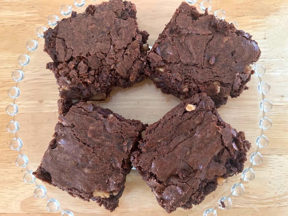 Brownies on a glass dish.