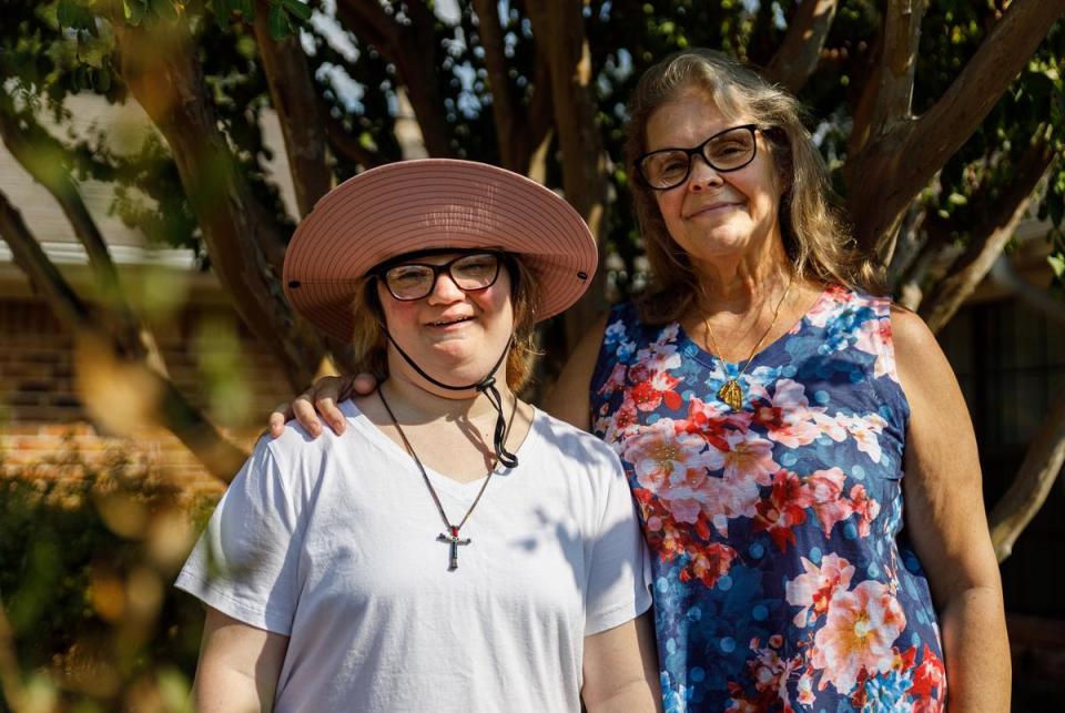Deborah Joslin and her daughter Katie Joslin stand in front of their North Austin home. Katie, 33, has Down Syndrome and Lupus and requires round-the-clock care and attention.