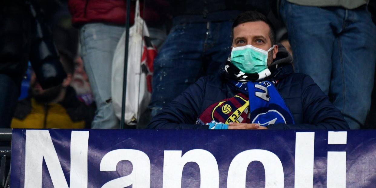 NAPLES, CAMPANIA, ITALY - 2020/02/25: Fan wearing masks for fear of coronavirus infection (COVID-19) at the San Paolo Stadium in Naples, during the football match UEFA Champions League, SSC Napoli vs FC Barcelona. (Photo by Salvatore Laporta/KONTROLAB/LightRocket via Getty Images)