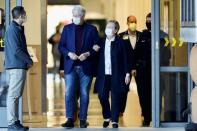 Former U.S. President Bill Clinton walks out of University of California Irvine Medical Center, in Orange, California