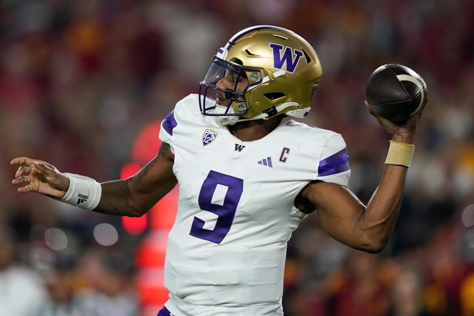 Washington quarterback Michael Penix Jr. throws a pass during the first half of the team's NCAA college football game against Southern California, Saturday, Nov. 4, 2023, in Los Angeles. (AP Photo/Ryan Sun)