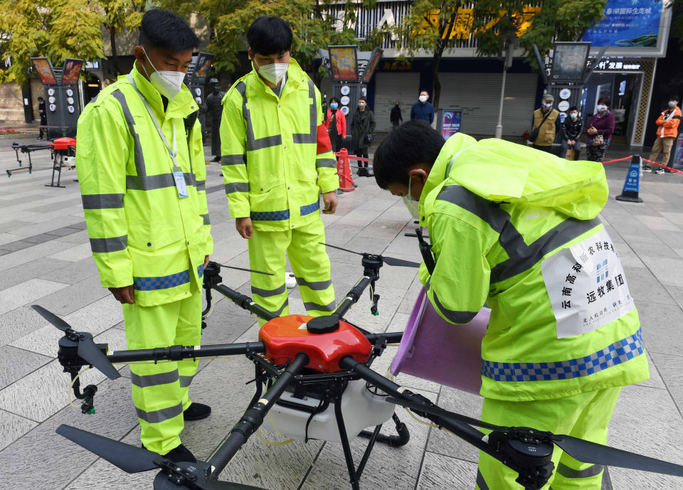 KUNMING, Feb. 27, 2020 -- Staff members refill a drone with disinfectant in Kunming City, southwest China's Yunnan Province, Feb. 27, 2020. Under the guidance of local authorities, eight drones have been assigned to carry out the daily disinfection work against novel coronavirus outbreak since Feb. 10 in some public areas of the city. (Photo by Yang Zongyou/Xinhua via Getty)