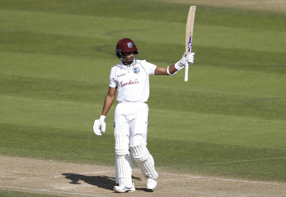 West Indies' Shane Dowrich raises his bat rot celebrate scoring fifty runs during the third day of the first cricket Test match between England and West Indies, at the Ageas Bowl in Southampton, England, Friday, July 10, 2020. (Adrian Dennis/Pool via AP)