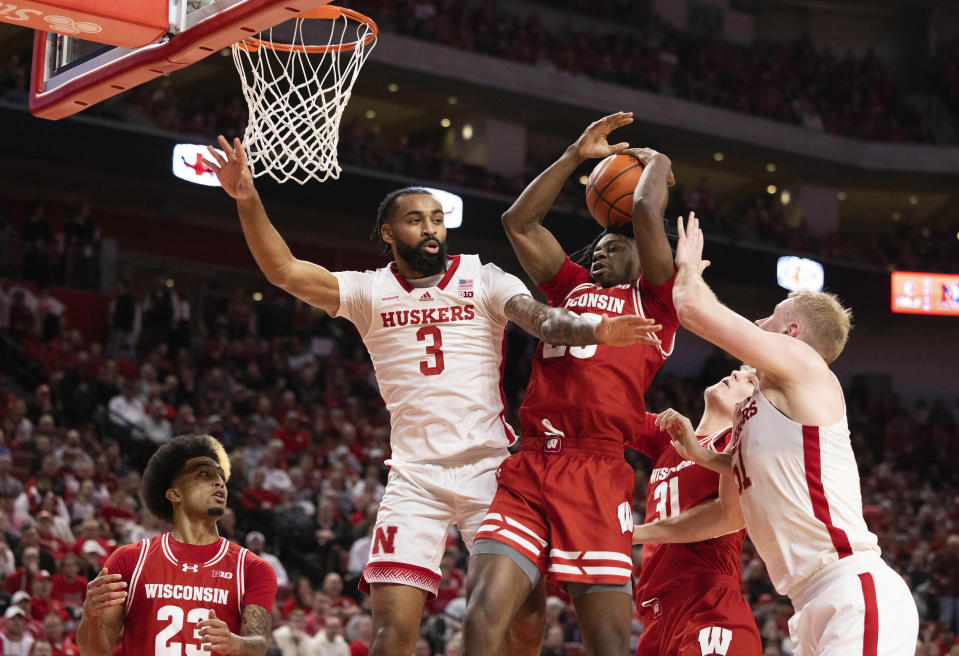 Wisconsin's John Blackwell, center, grabs a rebound against Nebraska's Brice Williams (3) and Rienk Mast, right, alongside Wisconsin's Chucky Hepburn (23) and Nolan Winter (31) during the first half of an NCAA college basketball game Thursday, Feb. 1, 2024, in Lincoln, Neb. (AP Photo/Rebecca S. Gratz)