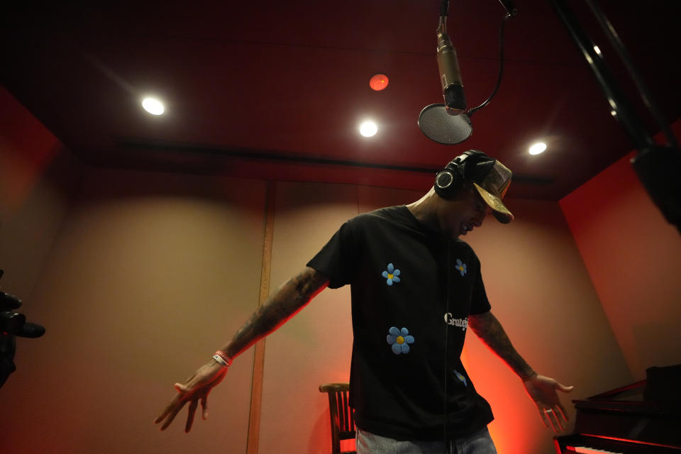 New York Giants tight end Darren Waller records an extended play at Interscope Records Studios In Santa Monica, Calif., Wednesday, June 21, 2023. The NFL, Interscope Geffen A&M Records and Electronic Arts Sports have partnered to empower players to pursue their passion of music and create the extended play project "Crowd Control." Songs from the EP were inserted into the video game "Madden NFL 24," released last month. (AP Photo/Damian Dovarganes)